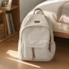 A simple and fashionable off-white backpack, a lightweight and large-capacity student commuting travel backpack details Picture